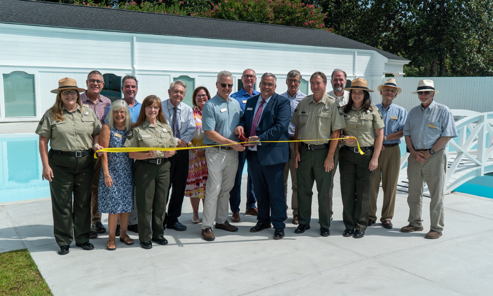 Ribbon cutting ceremony at Roosevelt Pools with crowd of supporters