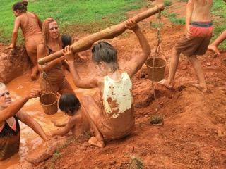 Children helping out in the mud